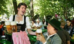 JUSTIN TRUDEAU SERVING ANGELA MERKEL SOME BEER IN GERMANY